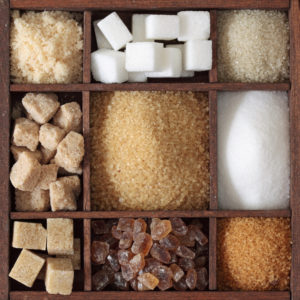 Various kinds of sugar in wooden box