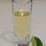 Whiskey/Negroni Barrel Aged Tequila Pale tequila shot glass with lime wedge